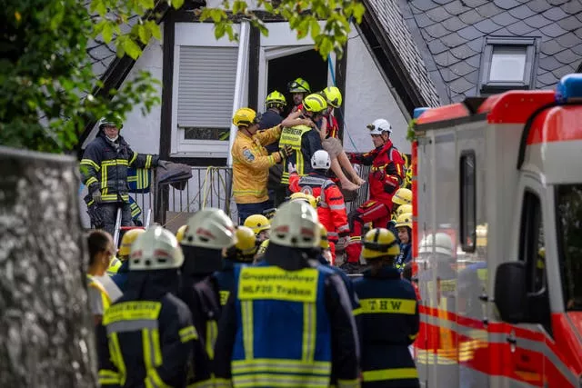 A person is rescued from the partially collapsed hotel in Kroev