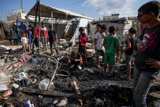 Children in bombed out wreckage