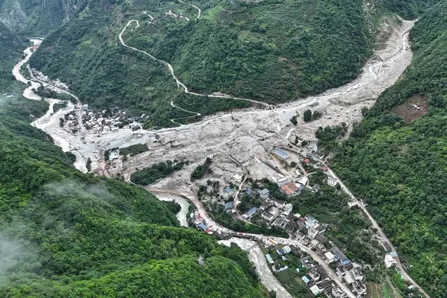 The impact of flash floods and mudslides can be seen near Ridi Village, Kangding City