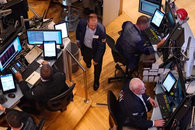 Traders work on the floor of the New York Stock Exchange 