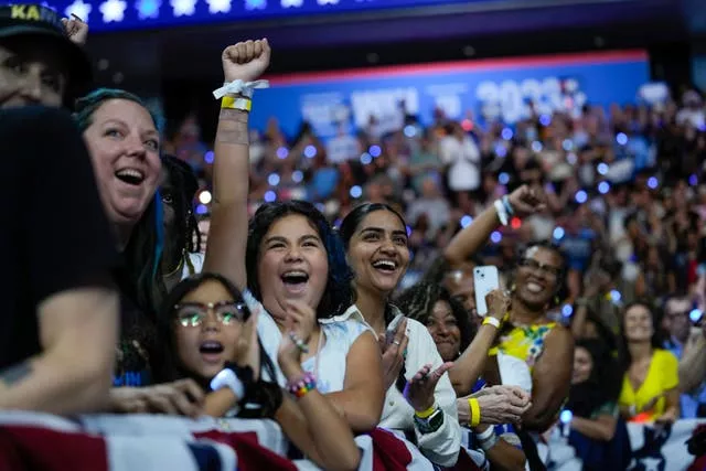 Supporters cheer as Kamala Harris and Tim Walz arrive at a campaign rally in Philadelphia