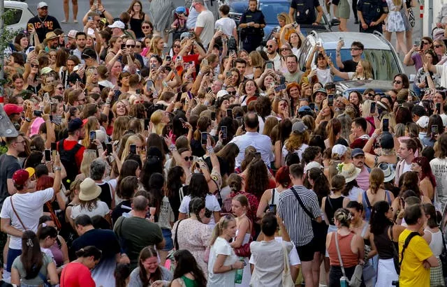 Swifties gather and sing in the city centre