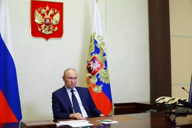 Russian President Vladimir Putin listens to acting governor of the Kursk region Alexei Smirnov during a meeting via video conference at the Novo-Ogaryovo state residence outside Moscow, Russia