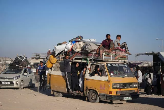 Palestinians flee on an overcrowded bus