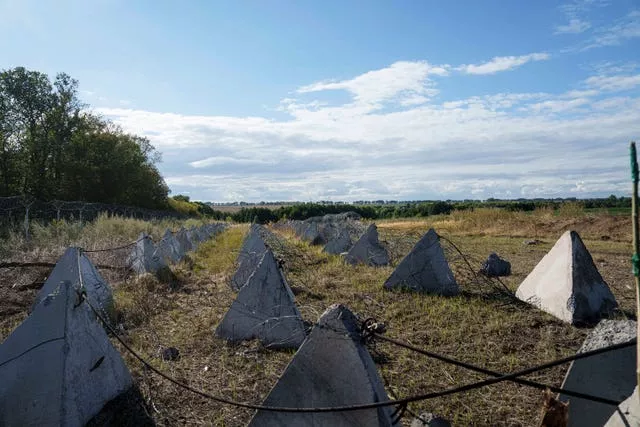 An anti-tank system known as 'dragon teeth' covers a field