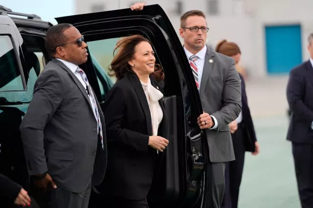 Democratic presidential nominee vice president Kamala Harris, centre, arrives to board Air Force Two at San Francisco International Airport 