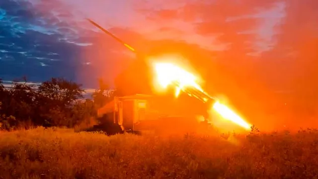 A Russian rocket launcher fires rockets toward Ukrainian position at an undisclosed location 