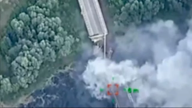 A strategically important bridge over the River Seym is destroyed by Ukrainian troops as they continue their incursion into the Kursk region, Russia, on Friday 