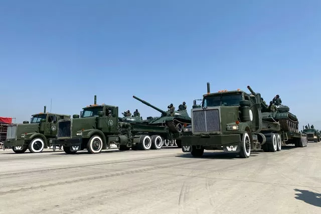 Lines of green military vehicles