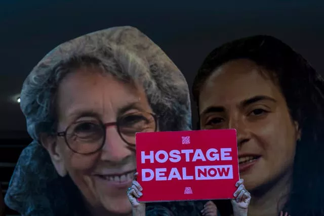 Relatives and supporters of Israeli hostages held by Hamas in Gaza hold photos of their loved ones during a protest calling for their return in Tel Aviv