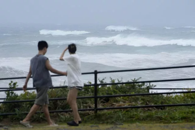 High waves hit a beach in Choshi, Chiba prefecture, east of Tokyo, as Typhoon Ampil moved past the area