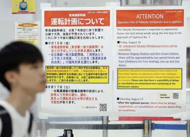 Station posters show the cancellation of Shinkansen bullet train services due to an approaching typhoon, at JR Tokyo station in Tokyo, Japan