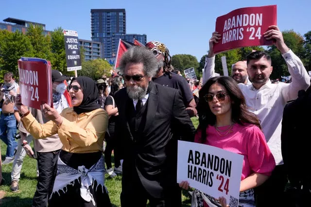 Progressive activist Cornel West watches a demonstration prior to a march to the Democratic National Convention