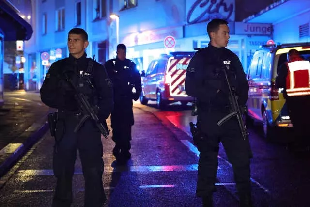 Police and ambulances near the scene where people were killed and injured in an attack at a festival in Solingen, western Germany