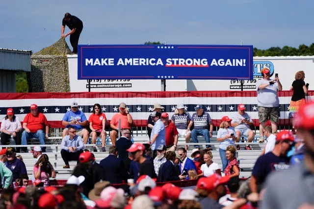 Sign that reads 'Make America strong again' with strong underlined