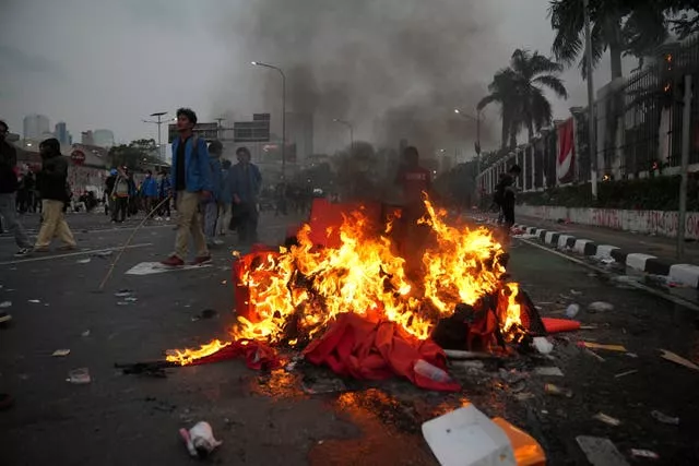 A fire burning on the streets during protests