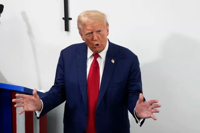 Republican presidential nominee and former president Donald Trump speaks during a stop at a campaign office in Roseville, Michigan 