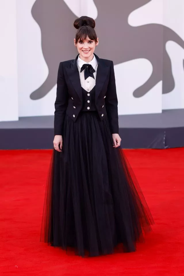 Winona Ryder poses for photographers upon arrival for the premiere of the film ‘Beetlejuice Beetlejuice’ 