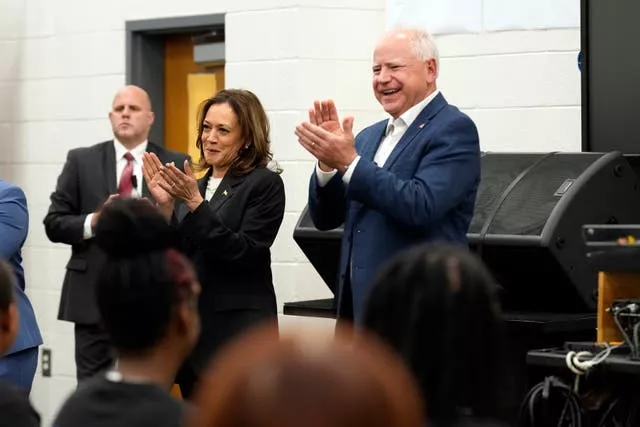 Kamala Harris and Tim Walz speak to marching band members at Liberty County High School in Hinesville, Georgia 