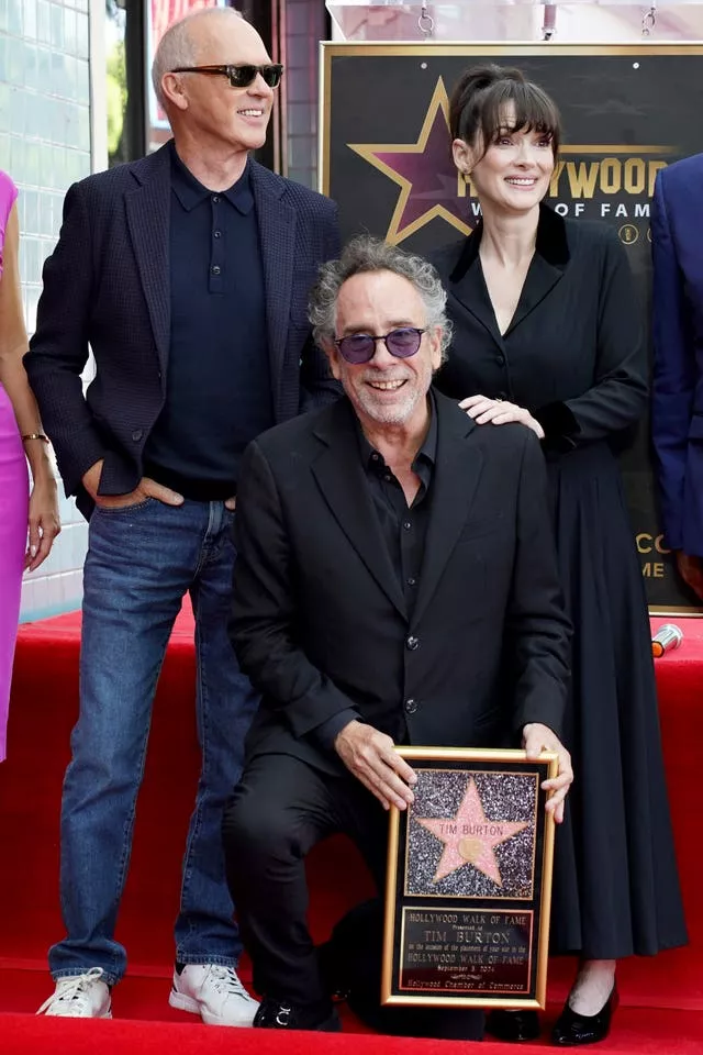 Michael Keaton, Tim Burton and Winona Ryder arrive at a ceremony honouring Burton with a star on the Hollywood Walk of Fame