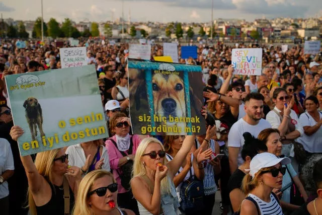 People march during a protest against a bill approved by Turkish legislators 