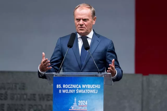 Donald Tusk speaking from a lectern