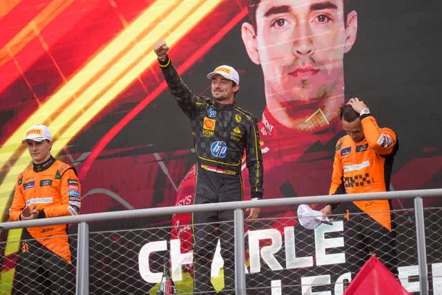 Charles Leclerc on the podium with McLaren drivers Oscar Piastri and Lando Norris