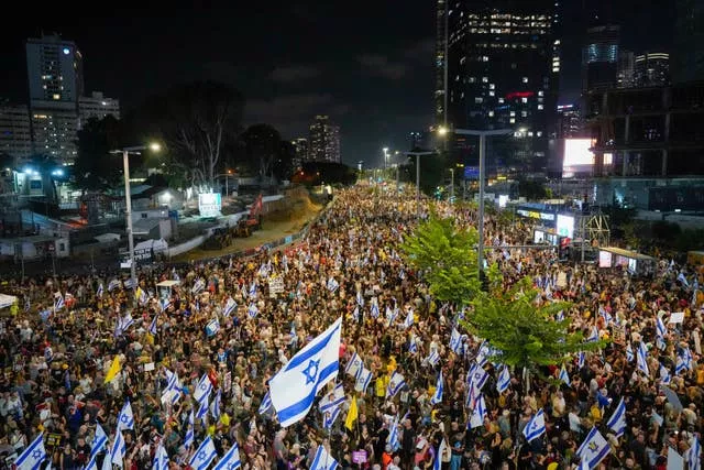 People protest against Prime Minister Benjamin Netanyahu’s government and call for the release of hostages held in the Gaza Strip by the Hamas militant group, in Tel Aviv, Israel, on Saturday