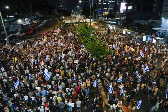 People attend a rally in Tel Aviv