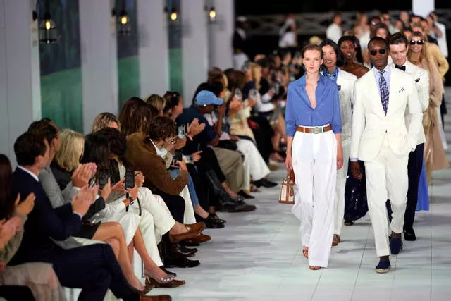 Models walk down NYFW S/S 2025 Ralph Lauren runway in blues, creams and tan suedes