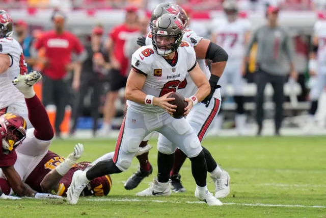 Tampa Bay Buccaneers quarterback Baker Mayfield tries to pass