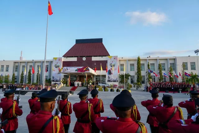 Pope Francis and East Timor’s President Jose Manuel Ramos-Horta, attend a welcome ceremony outside the Presidential Palace in Dili, East Timor