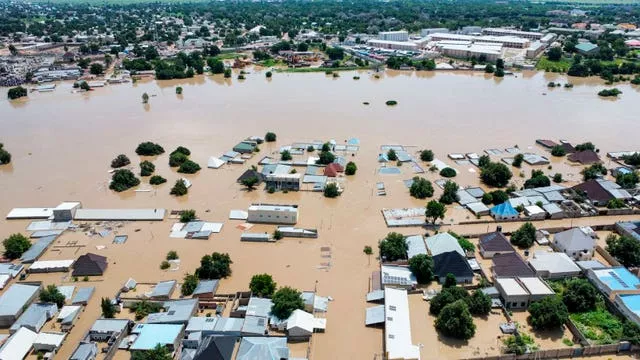 Houses are partially submerged following a dam collapse in Maiduguri, Nigeria