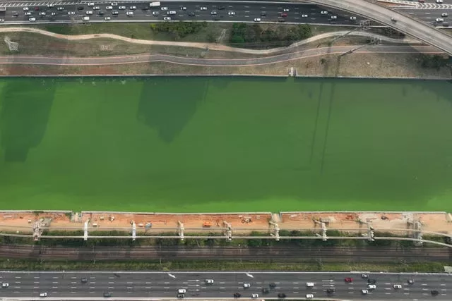 The Pinheiros River is green in Sao Paulo, Brazil 