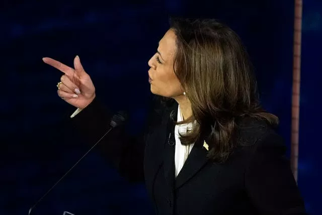 Democratic presidential nominee Vice President Kamala Harris gestures at Donald Trump