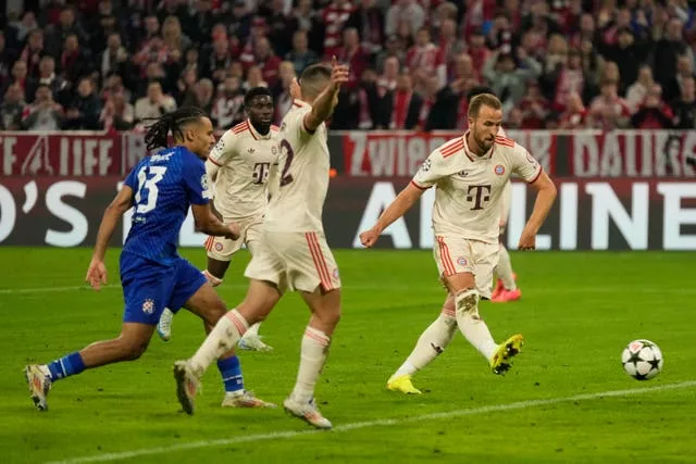 Harry Kane, right, scores his second goal against Dinamo Zagreb to become the leading English goalscorer in the Champions League