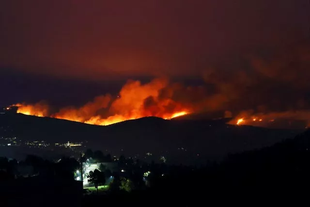 Fires rage on the hills around a town in northern Portugal