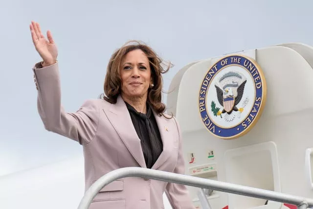 Kamala Harris waves before boarding Air Force Two