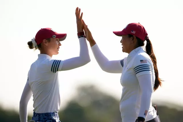 Nelly Korda and Allisen Corpuz exchange a high five