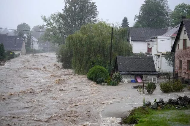 Flood water on streets, with houses