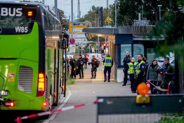 German police officers stop a bus at the border between Germany and France in Kehl, Germany