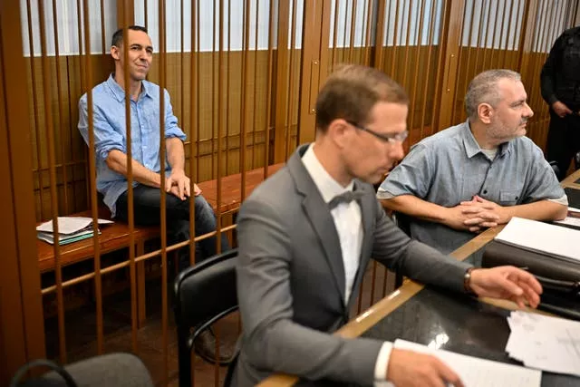 Laurent Vinatier sits in a cage in a Moscow courtroom