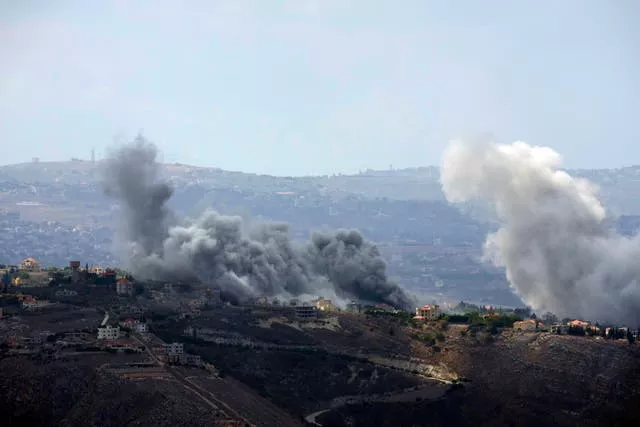 Smoke rises from air strikes