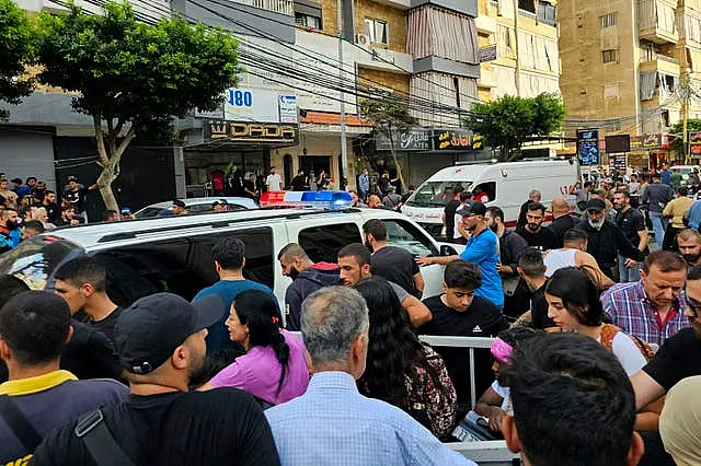 Ambulances arrive at the scene of an Israeli missile strike in the southern suburbs of Beirut