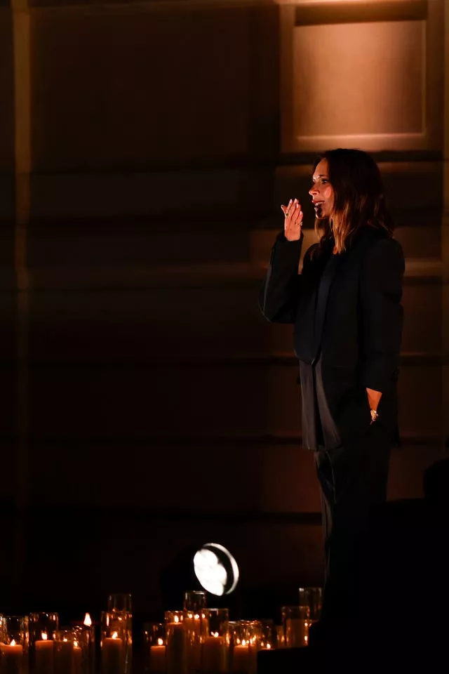 Victoria Beckham accepts applause after her show