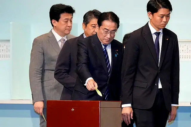 Japan’s Prime Minister Fumio Kishida, centre, casts his ballot at the Liberal Democratic Party’s leadership election in Tokyo