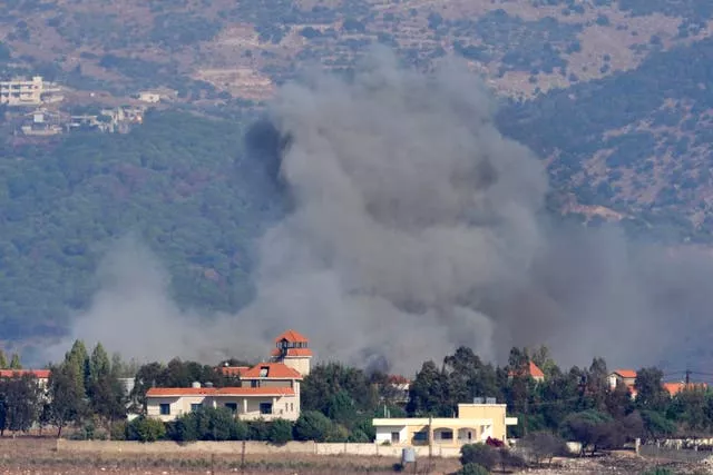 Smoke rises from an Israeli airstrike on a village