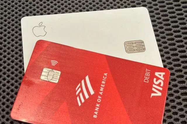 An Apple credit card is shown with a Visa debit card