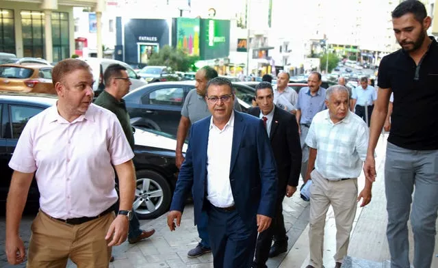 Tunisian presidential candidate Zouhair El Maghzaoui, meets Tunis residents during his campaign tour 