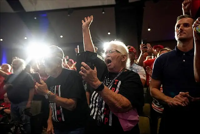 Supporters cheer as Donald Trump speaks at a campaign event in Prairie du Chien